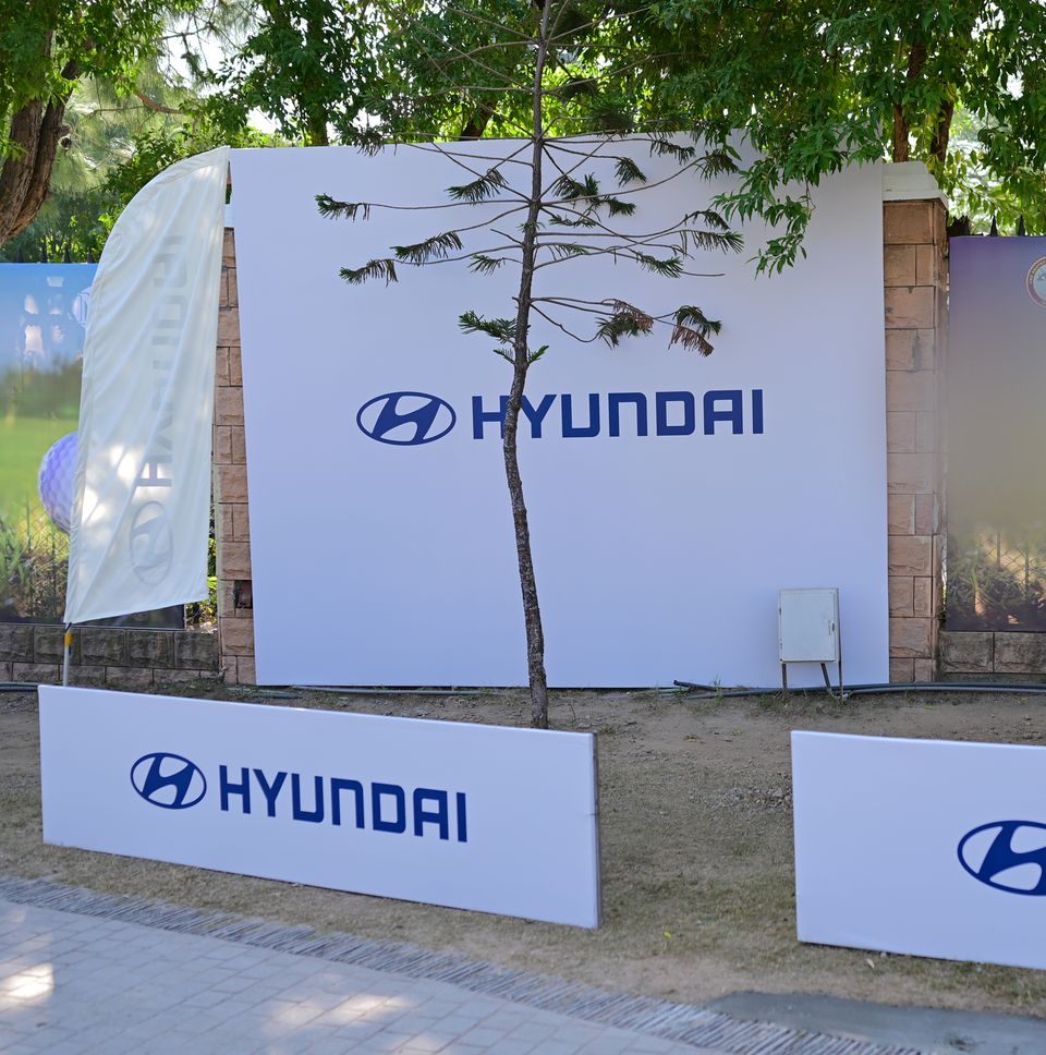 Branded boards beside the course