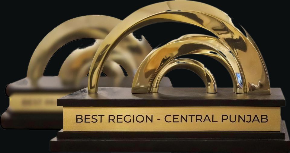 Custom trophy with gold arches on a wood base