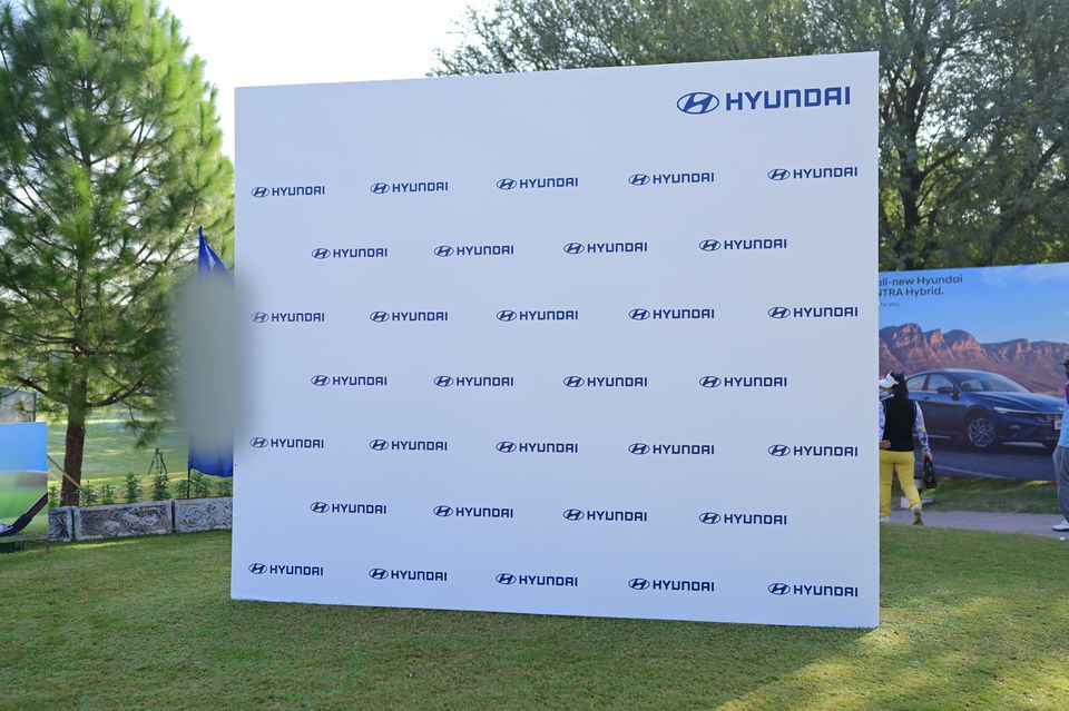 Step-and-repeat wall on the lawn